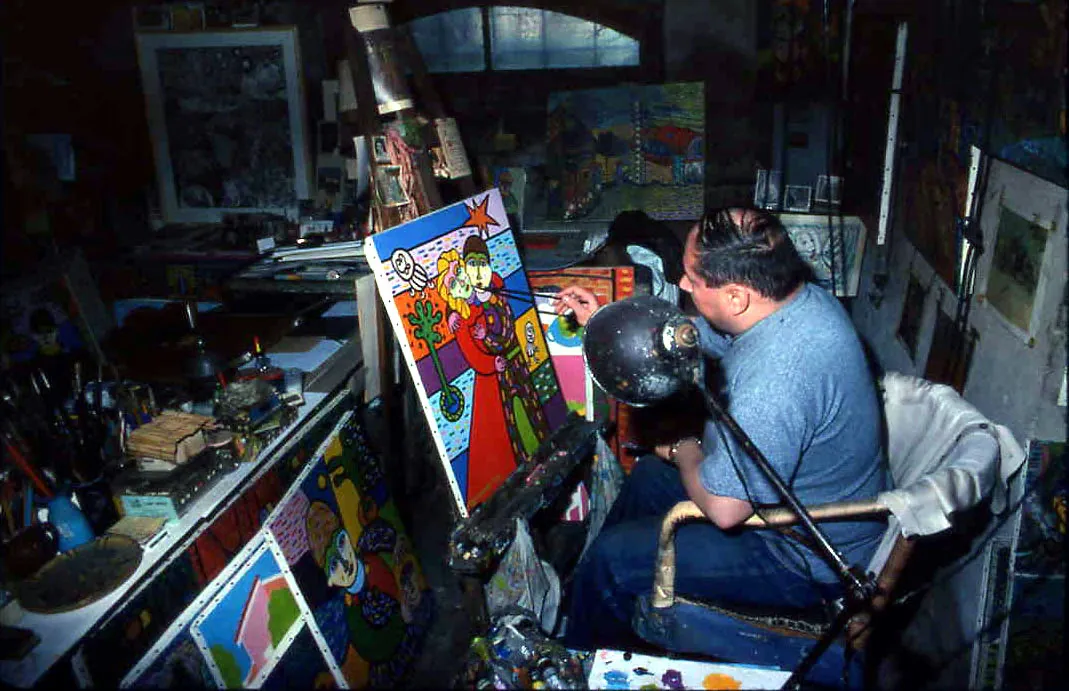 Guy dans son atelier en train de peindre